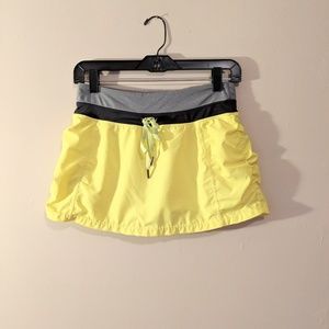 Yellow tennis athletic skirt with shorts